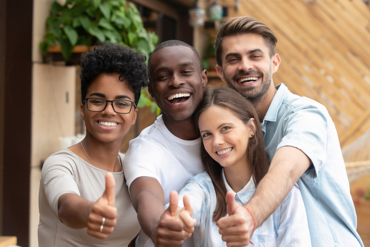 Happy multi ethnic friends group showing thumbs up, smiling diverse young people looking at camera with like gesture recommend good quality racial diversity equality, multiracial friendship, portrait